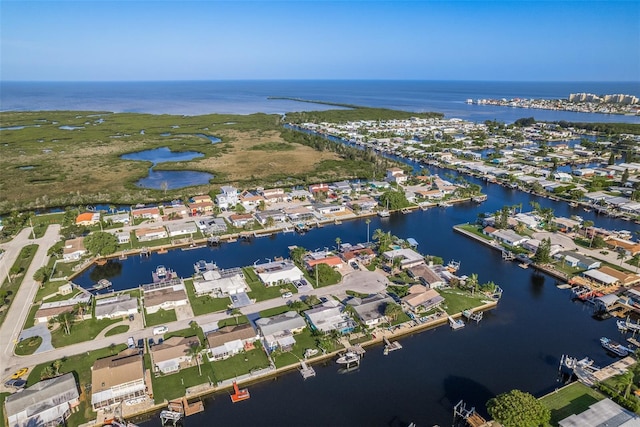 bird's eye view featuring a water view and a residential view