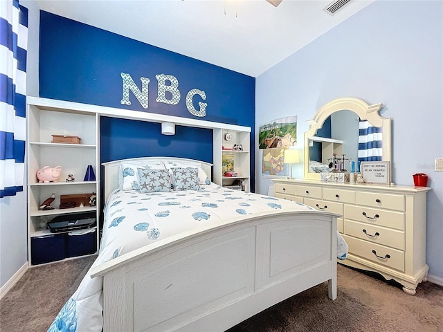 bedroom with a ceiling fan, visible vents, dark carpet, and baseboards