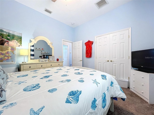 carpeted bedroom with a ceiling fan, visible vents, and a closet