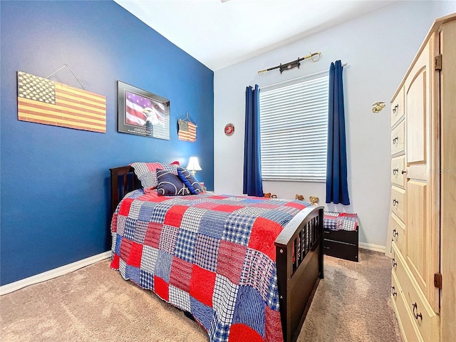 bedroom with baseboards and carpet flooring