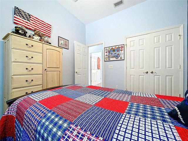 bedroom with visible vents and a closet