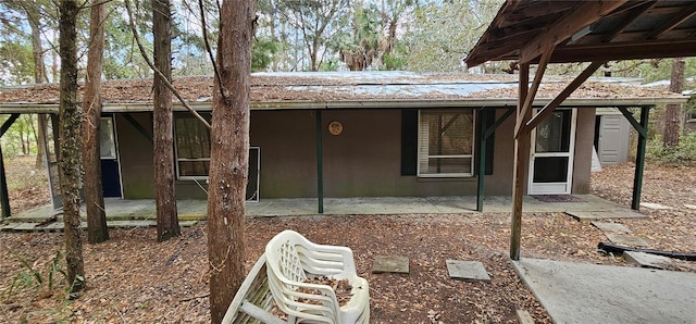 rear view of property featuring a patio