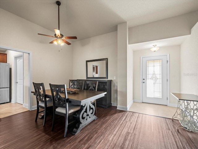 dining area featuring ceiling fan, wood finished floors, and baseboards