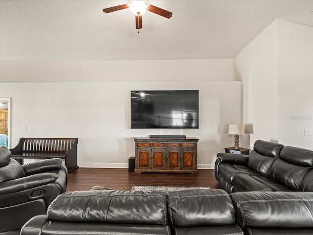 living area with wood finished floors, a ceiling fan, and baseboards