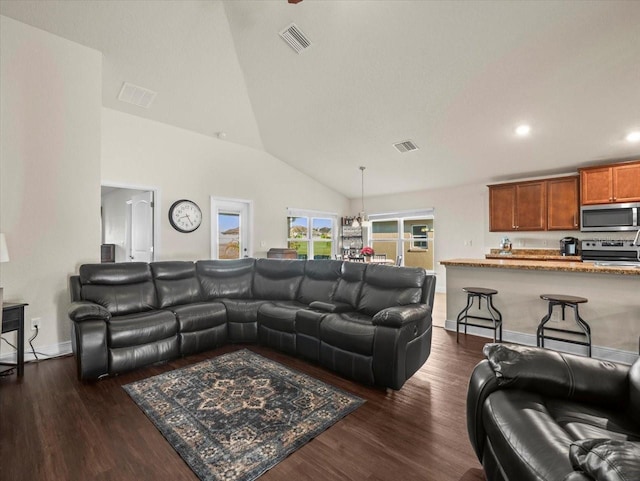 living room featuring baseboards, visible vents, dark wood finished floors, and recessed lighting