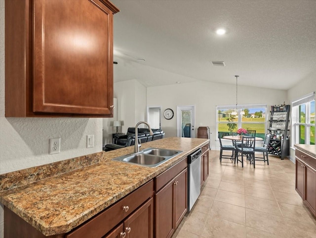 kitchen featuring light tile patterned flooring, a sink, vaulted ceiling, stainless steel dishwasher, and decorative light fixtures