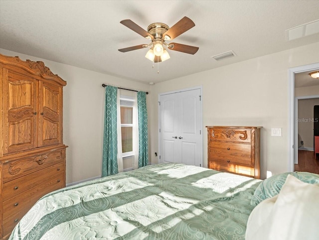 bedroom featuring visible vents and a ceiling fan