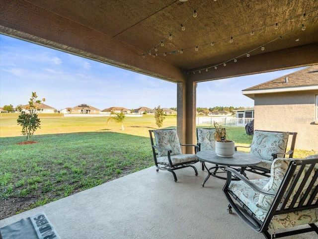 view of patio featuring fence