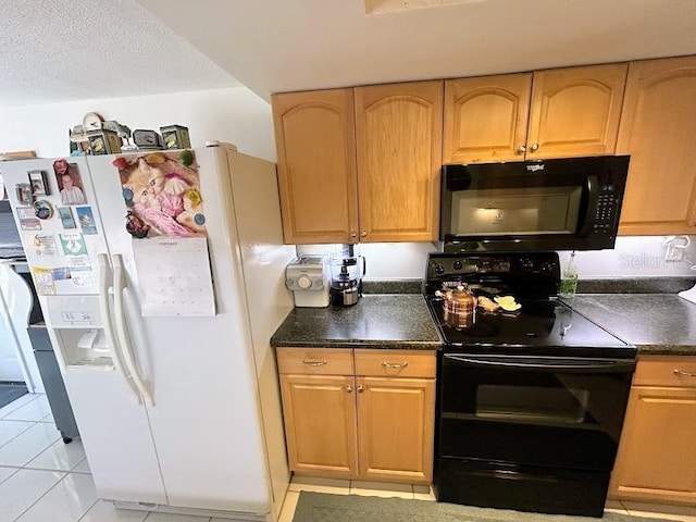 kitchen featuring a textured ceiling, black appliances, dark countertops, and light tile patterned flooring