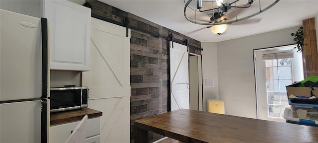 interior space featuring a barn door