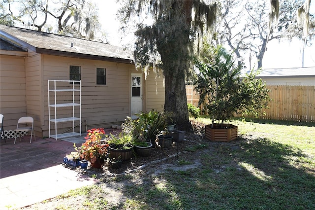 view of yard featuring a patio area and fence