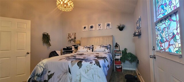 6825 Main St, New Port Richey, FL 34653 - bedroom with lofted ceiling and a textured ceiling
