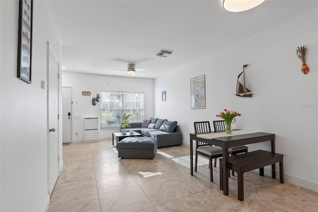 6027 Bayside Key Dr, Tampa, FL 33615 - living room featuring light tile patterned floors, baseboards, visible vents, and a ceiling fan