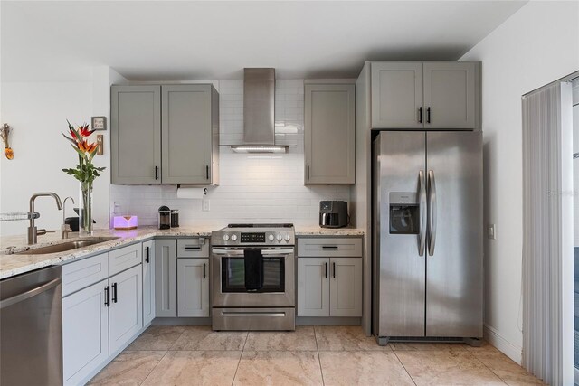 6027 Bayside Key Dr, Tampa, FL 33615 - kitchen with wall chimney exhaust hood, appliances with stainless steel finishes, gray cabinets, and backsplash