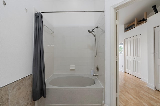 6027 Bayside Key Dr, Tampa, FL 33615 - full bathroom with shower / bath combo and wood finished floors
