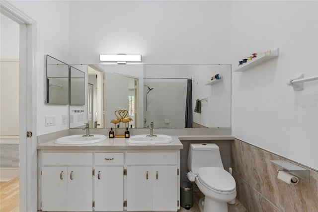 6027 Bayside Key Dr, Tampa, FL 33615 - bathroom featuring a shower, a sink, toilet, and double vanity