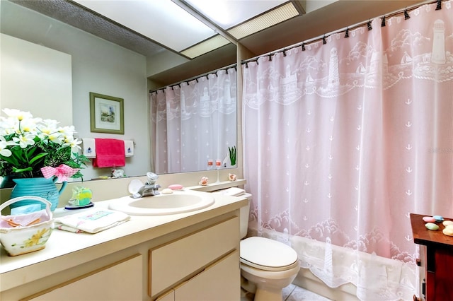 bathroom featuring toilet, a shower with curtain, and vanity