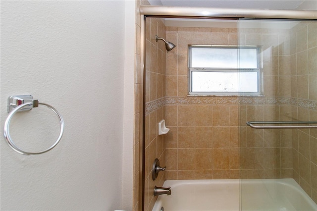 bathroom with enclosed tub / shower combo