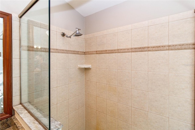 full bath featuring tiled shower