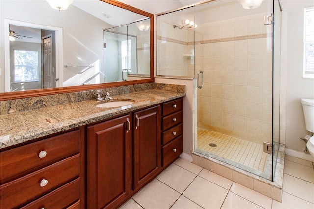 full bathroom with a stall shower, visible vents, toilet, tile patterned flooring, and vanity