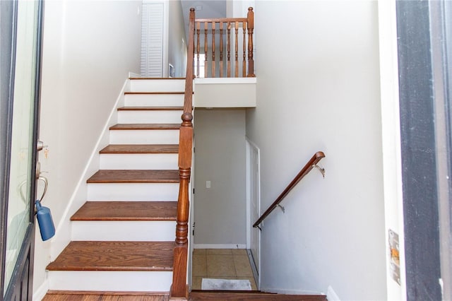 stairs featuring tile patterned floors