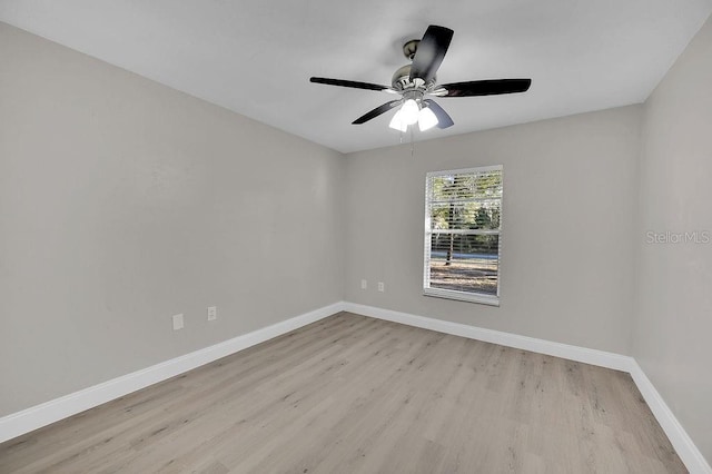 unfurnished room with light wood finished floors, ceiling fan, and baseboards