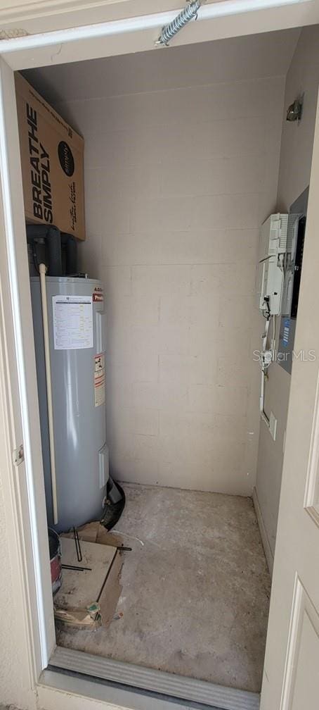 utility room with electric water heater