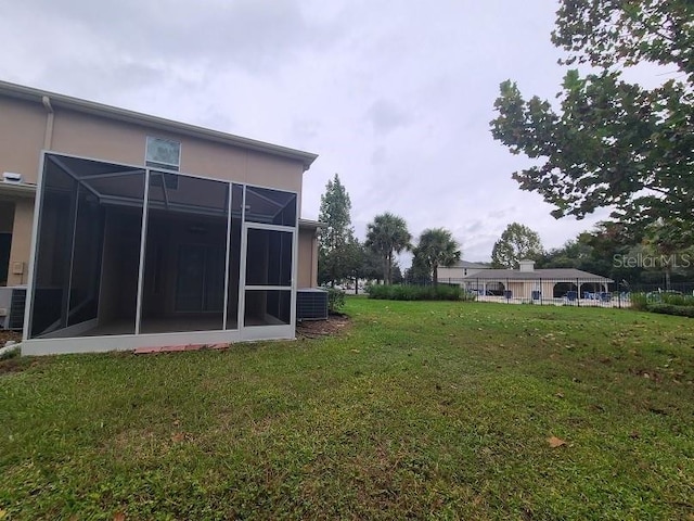 view of yard featuring central air condition unit