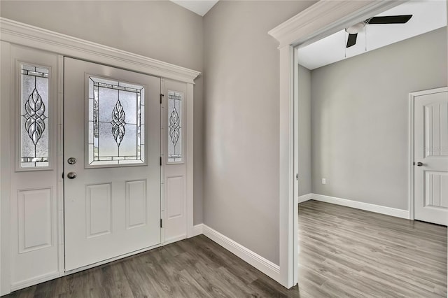 entrance foyer featuring wood finished floors, a ceiling fan, and baseboards