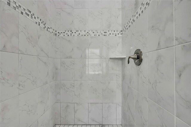 details featuring a tile shower