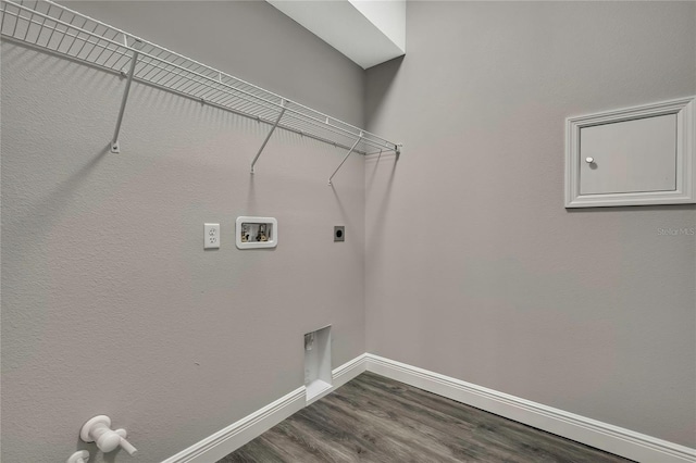 washroom featuring washer hookup, dark wood-style flooring, hookup for an electric dryer, laundry area, and baseboards