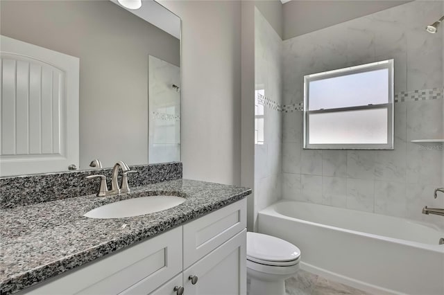 bathroom with toilet, tub / shower combination, and vanity