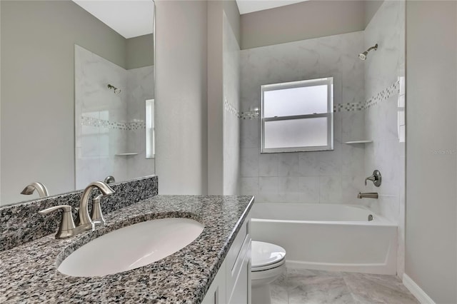 bathroom with baseboards, bathing tub / shower combination, toilet, and vanity