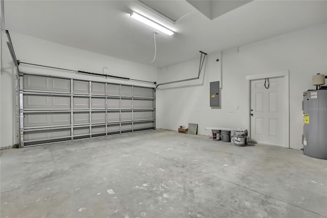 garage featuring water heater and electric panel