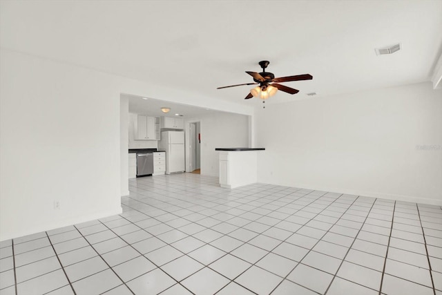 unfurnished living room featuring visible vents, ceiling fan, and light tile patterned floors