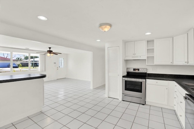 kitchen featuring white cabinets, dark countertops, dishwashing machine, stainless steel range with electric stovetop, and open shelves