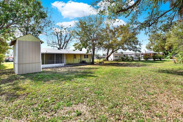 view of yard featuring a sunroom