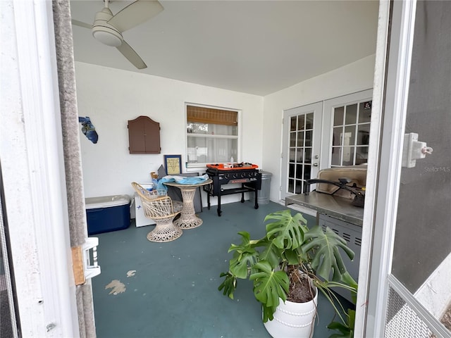 sunroom with french doors and ceiling fan