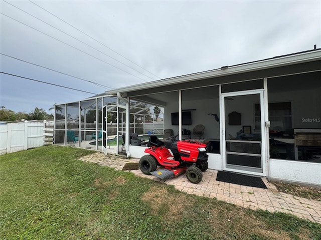 exterior space featuring a lanai and fence private yard