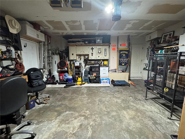 garage with a workshop area and gas water heater