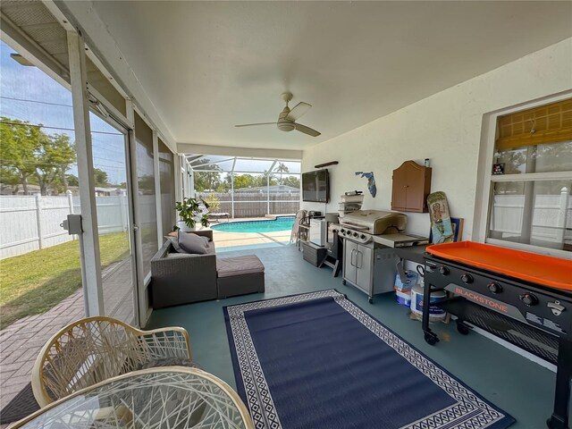 view of patio / terrace featuring a fenced backyard, a ceiling fan, and a fenced in pool