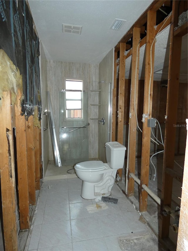 7308 Mako Dr, Hudson, FL 34667 - bathroom featuring visible vents, toilet, and a walk in shower