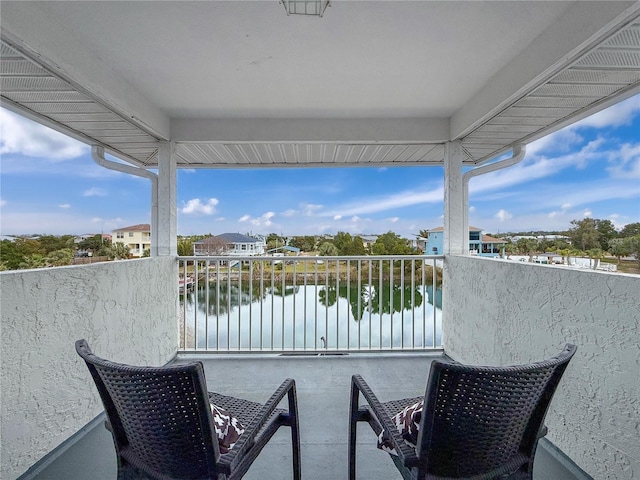 balcony featuring a water view