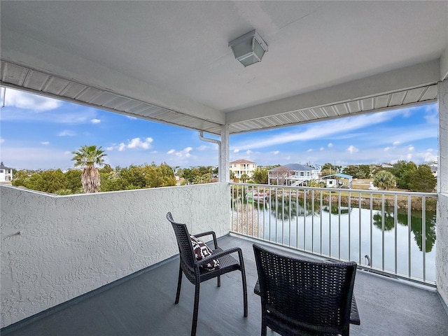 balcony featuring a water view