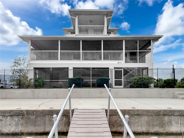 back of property featuring a sunroom