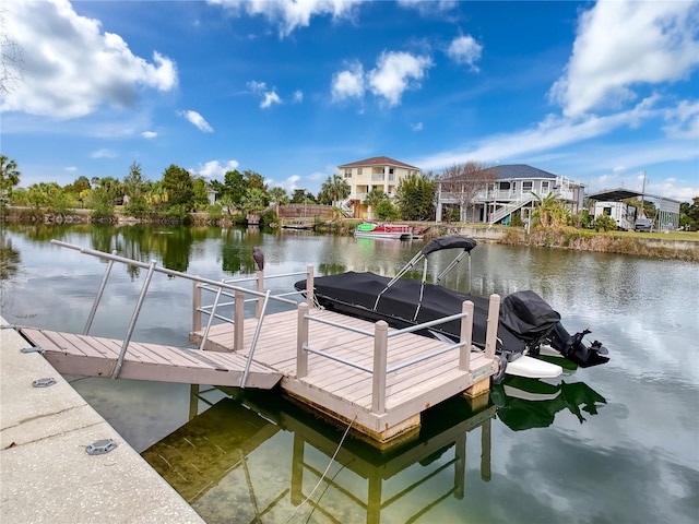 dock area with a water view and a residential view