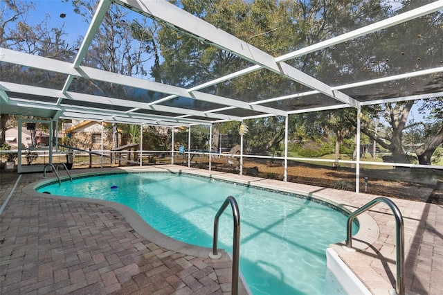 pool with a lanai and a patio