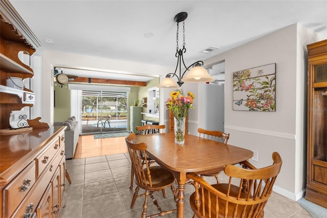 dining room with visible vents, baseboards, and light tile patterned floors