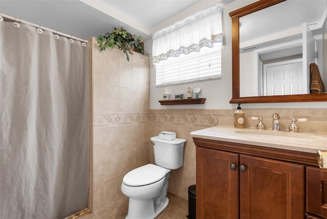 bathroom featuring tile walls, toilet, tile patterned flooring, vanity, and a shower with curtain