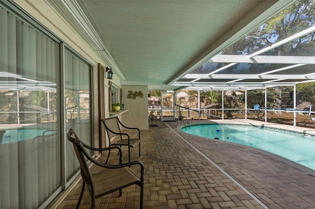 pool with a patio area and a lanai